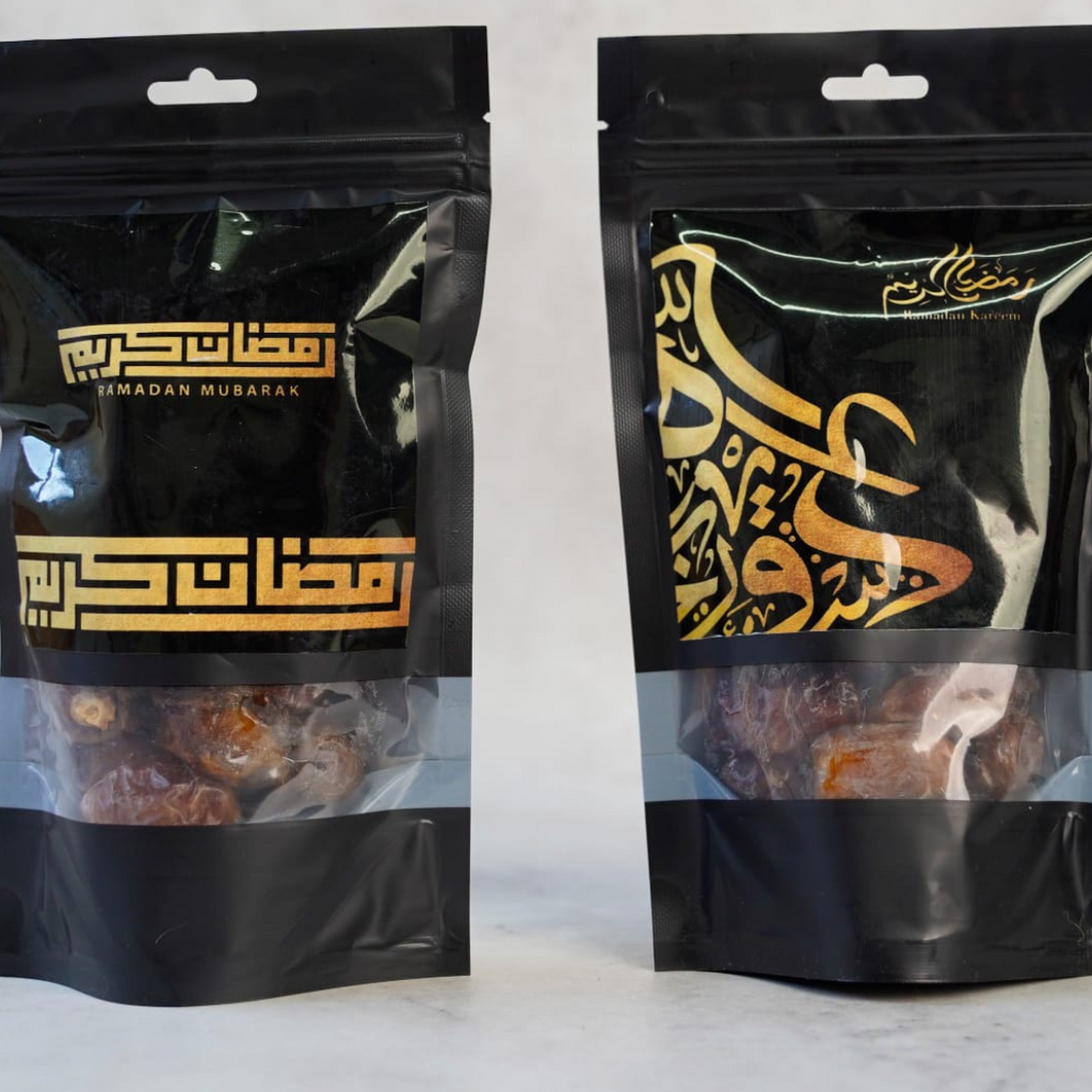 Two black snack bags with gold text on a white background, featuring the brand 'Snack in Dash'.