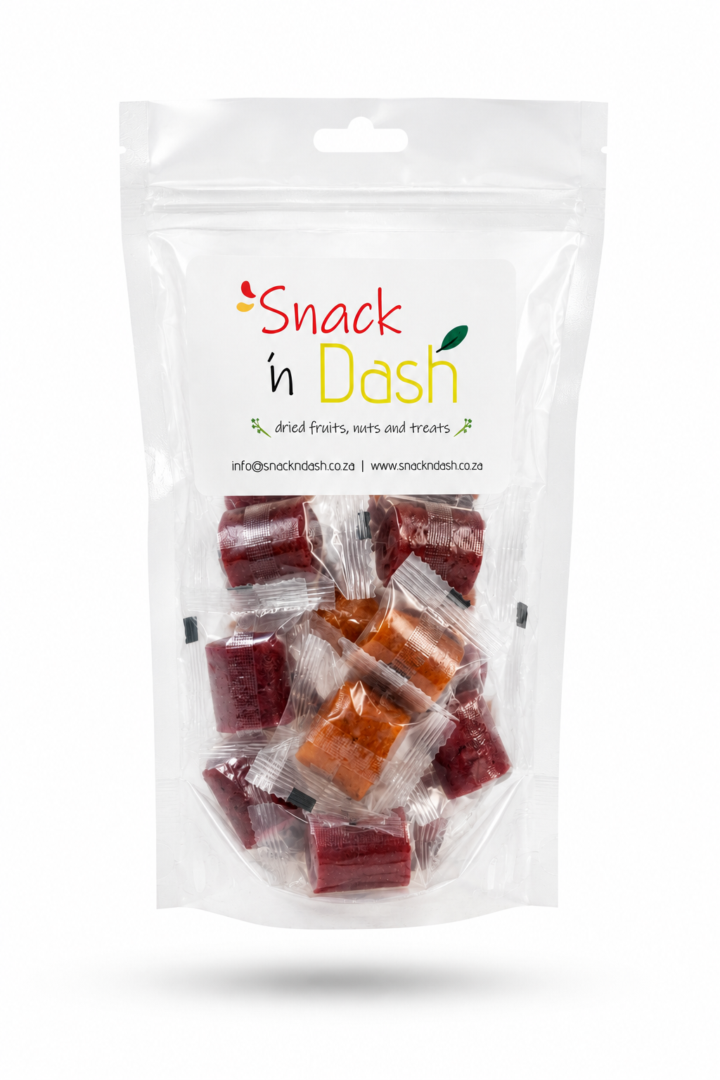 A clear stand-up pouch package of Snack n Dash dried fruits, nuts, and treats, showing several individually wrapped dark red and orange pieces inside, on a white background.