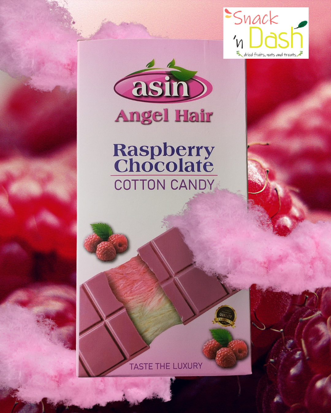 Box of asin Angel Hair Raspberry Chocolate Cotton Candy with pink cotton candy and raspberries in the background.