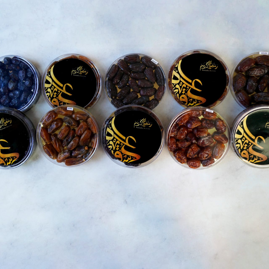 Assorted dried fruits in containers with 'Snack 'n Dash' logo on a light background