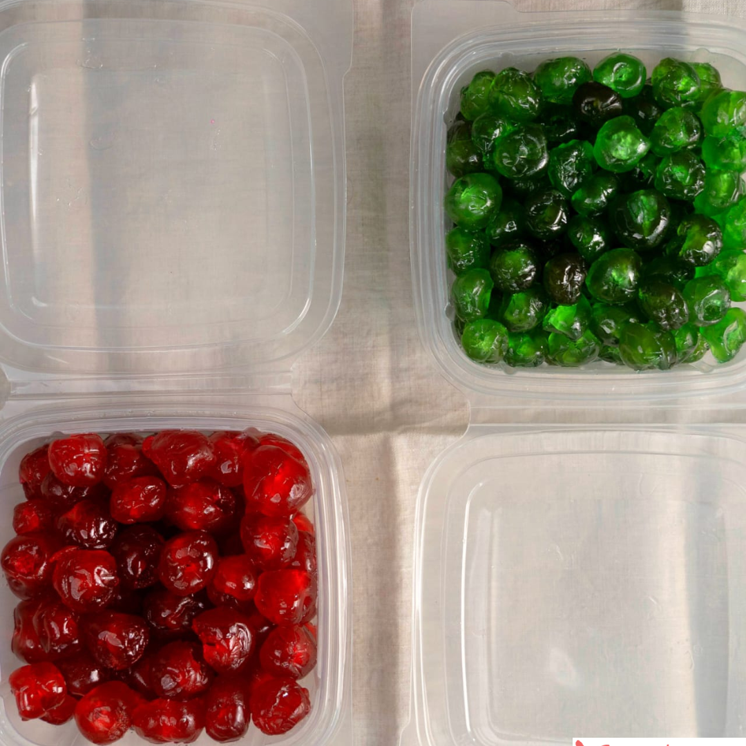 Two containers with red and green gummy bears on a textured surface, branded 'Snack Dash'.