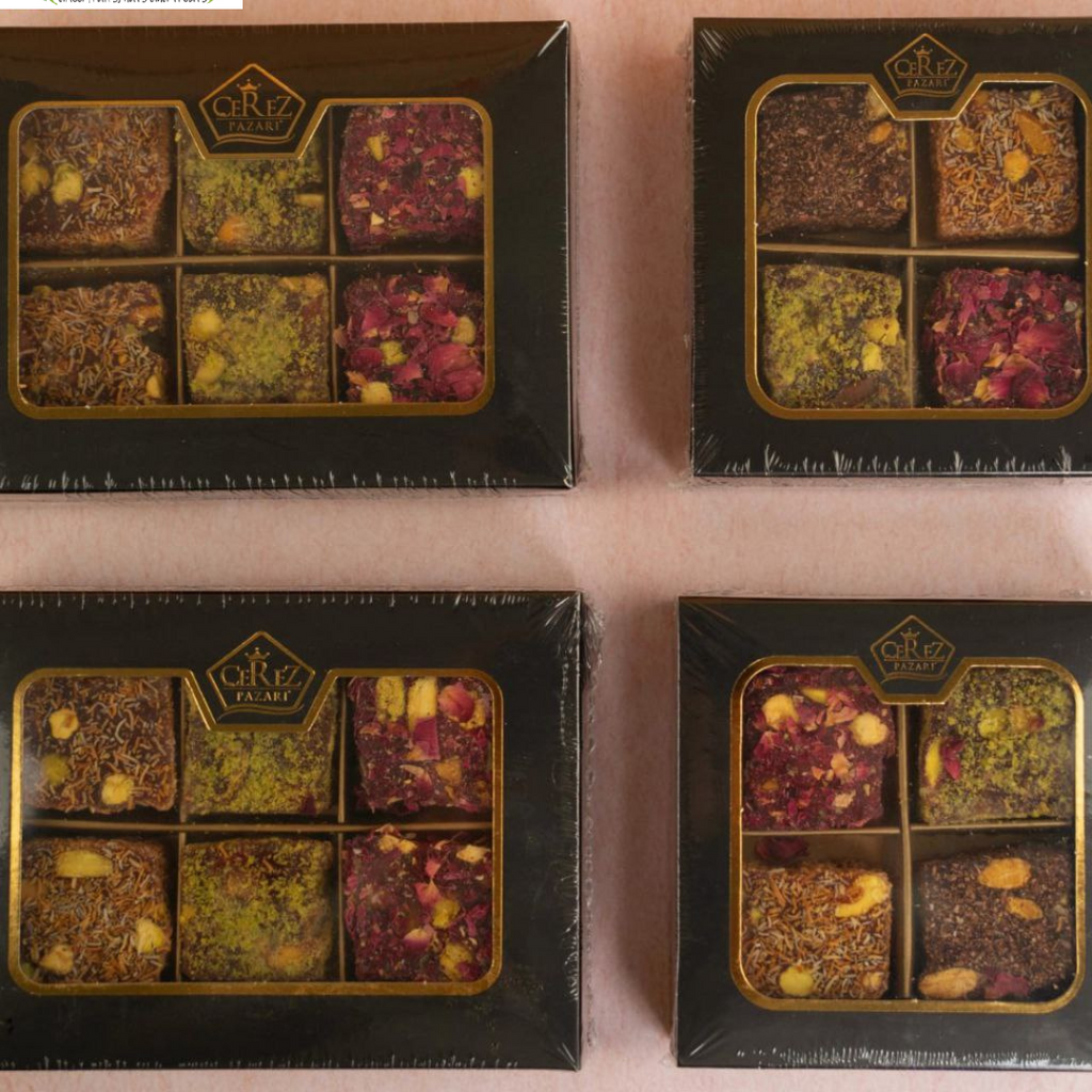 Four boxes of GRT Assorted Turkish Dleights on a pink background with 'Snack n Dash' branding.