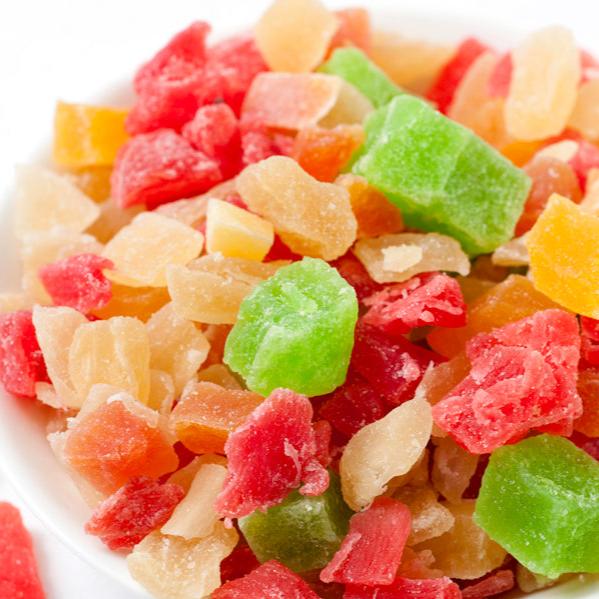 A variety of diced dried fruits including kiwi, strawberry, papaya, pineapple, and passion fruit.